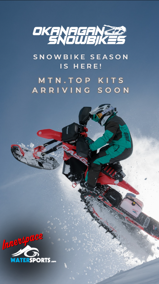 man on snowbike making a jump