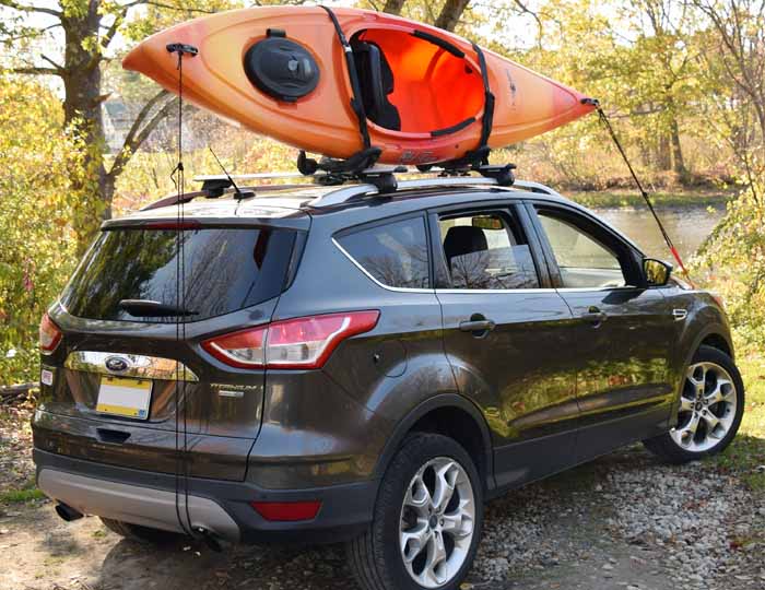 red kayak on malone rack