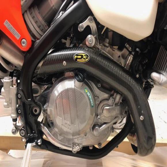 Close-up of a motorcycle engine with visible branding on a blurred background