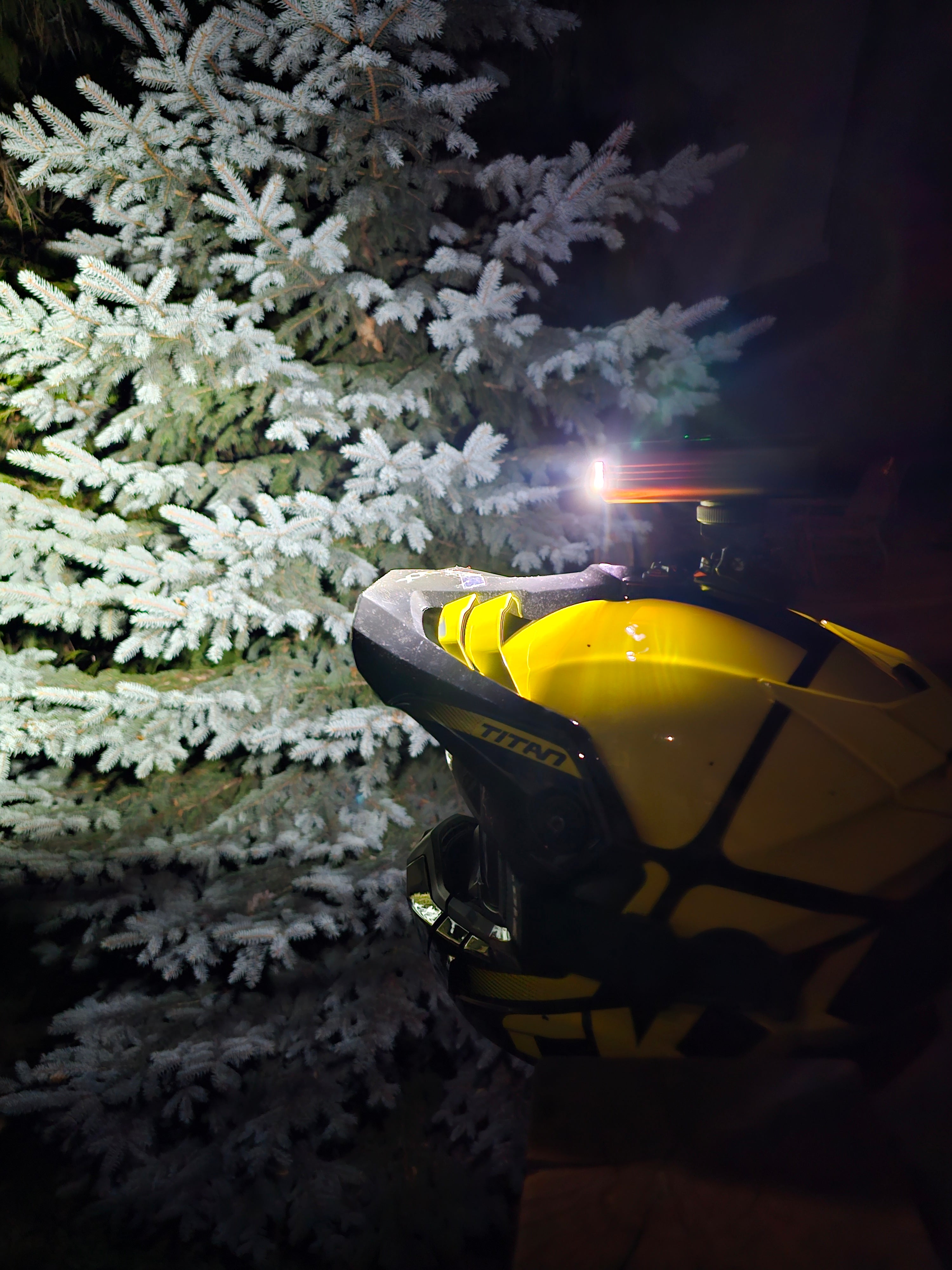 Yellow helmet with a light source on a dark background