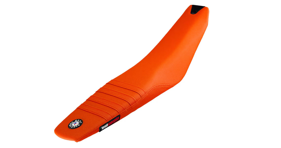Orange motorcycle seat with a brand logo on a white background