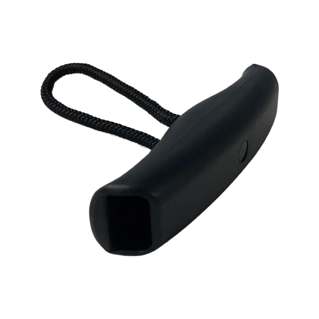 Black dog muzzle with a strap on a white background