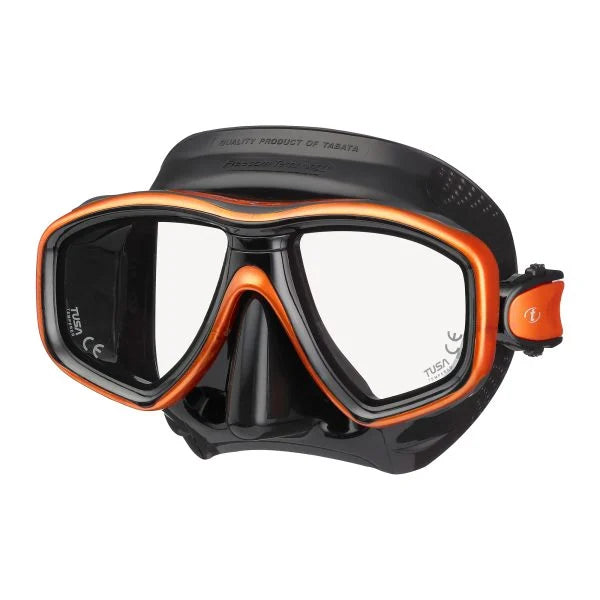 A black and orange full-face diving mask with clear lenses, shown against a plain white background. The brand name 'TABATA' is visible on the strap adjustment piece and the side of the lens.