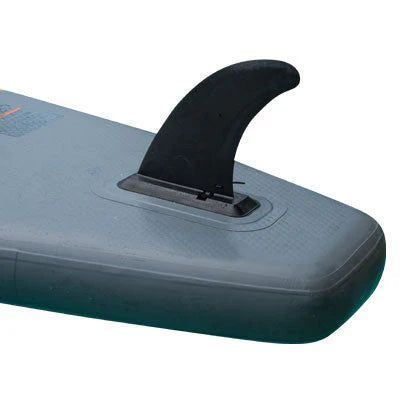Close-up of a black fin attached to an inflatable paddleboard on a white background