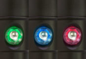 Three colored buttons (green, blue, red) on a black background