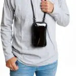 Person wearing a gray hoodie with a black crossbody bag