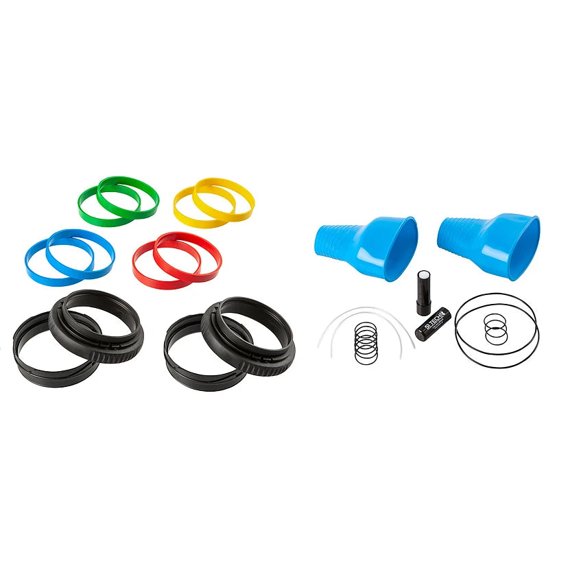 Set of colorful rubber bands, blue plastic cups, and black rubber bands on a white background.