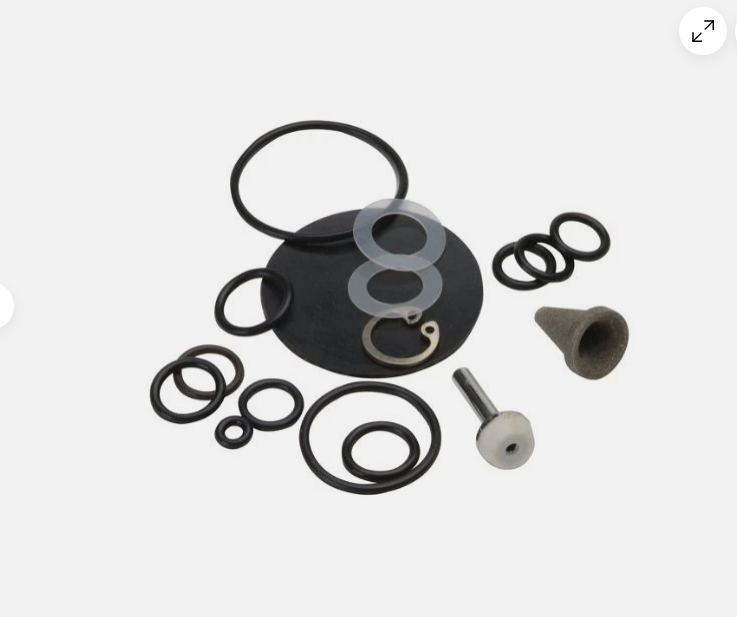 A set of black rubber O-rings and seals with a small gray plastic cone and a metal bolt with a white plastic end, arranged on a light gray background.
