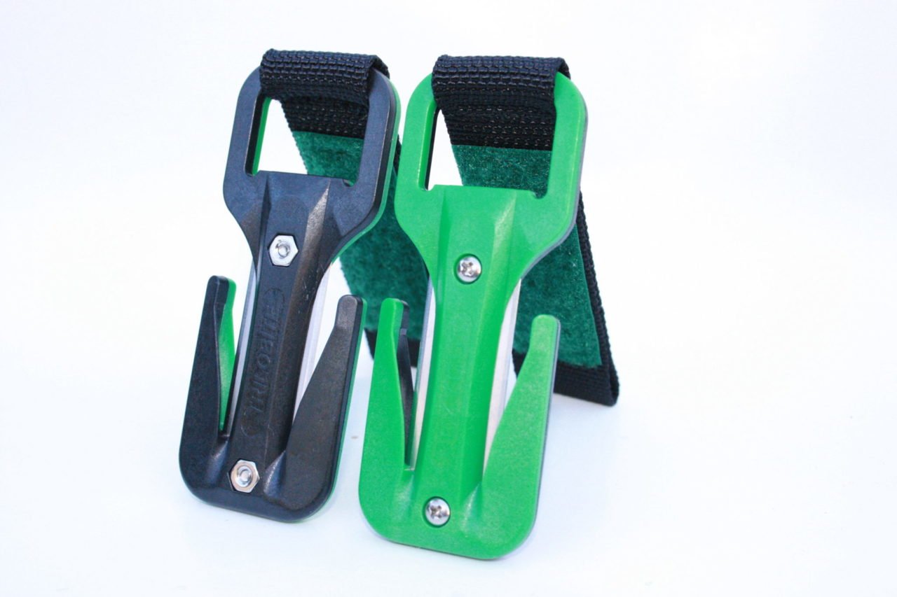 Two green and black archery bow stands on a white background