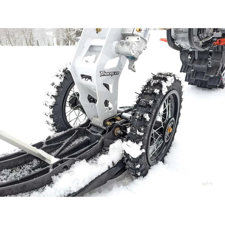 Motorcycle with snow chains on a snowy surface
