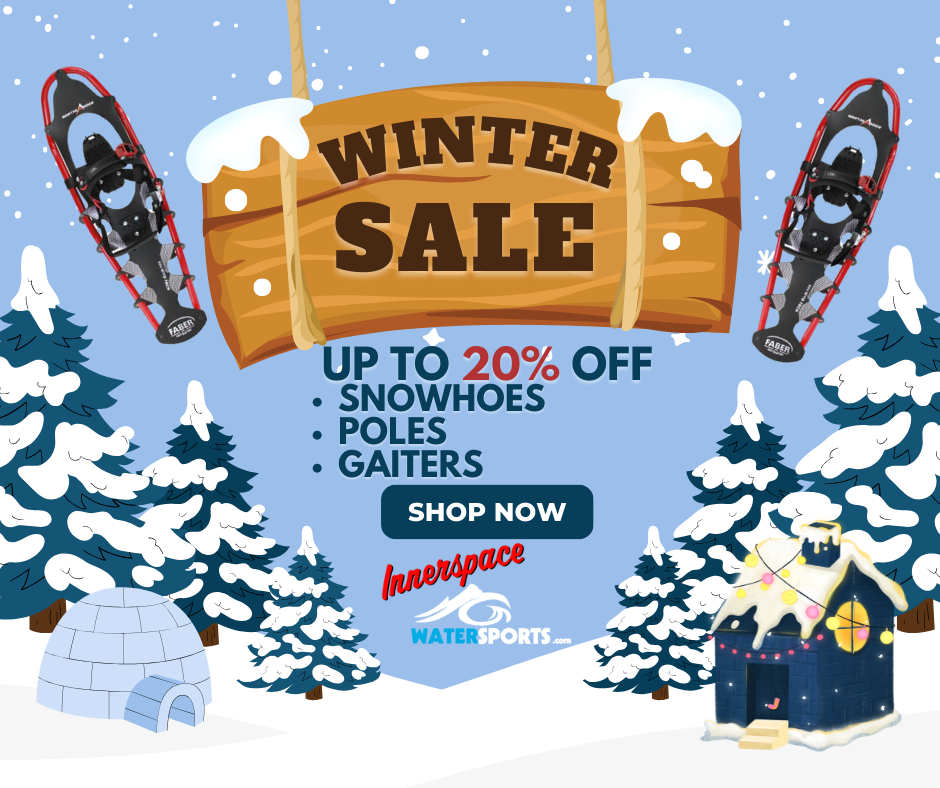 Winter sale advertisement with snowshoes, a wooden sign, and snowy landscape.