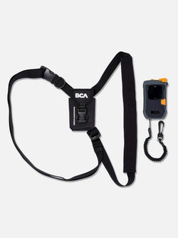 Black BCA harness and remote control on a white background