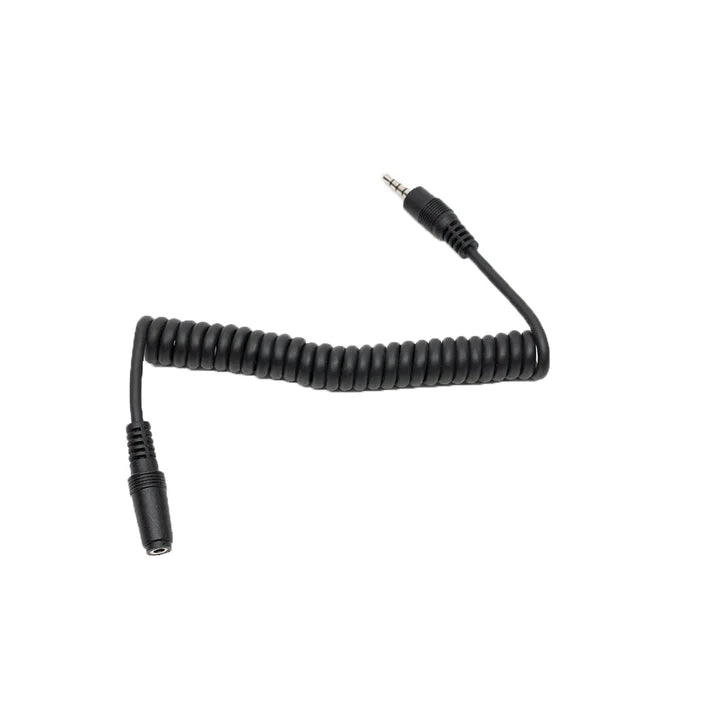 Black coiled audio cable on a white background