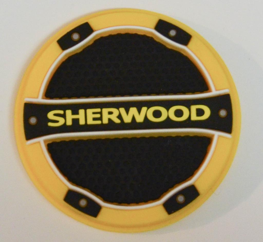 A circular yellow and black Sherwood branded badge or emblem with the brand name in yellow text across a black horizontal band.