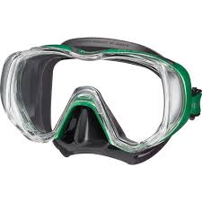 A diving mask with a clear lens, black silicone nose and strap, and green trim accents.