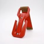 Red metal car jack on a white background
