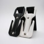 Two bottle openers, one black and one white, on a plain background.