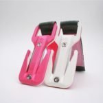 Two pink and white hair clippers on a white background