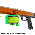 Wooden rifle with green scope and visible branding on a white background